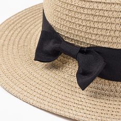 This absolutely perfect straw hat is the perfect compliment to any summer and spring outfit. This gorgeous woven pattern and color accessorize your look perfectly with a fabulous silk black or striped ribbon. Come in nine fabulous colors and styles. Adjustable Black Straw Hat Made Of Paper Straw, Classic Spring Hat With Bow, Chic Boater Hat With Ribbon For Beach, Summer Black Paper Straw Sun Hat, Black Paper Straw Sun Hat For Summer, Chic Spring Boater Hat In Paper Straw, Adjustable Boater Hat With Bow And Short Brim, Adjustable Straw Boater Hat For Picnics, Adjustable Straw Boater Hat For Picnic