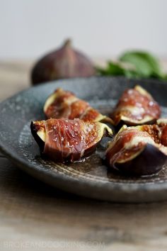 figs with olives on a black plate