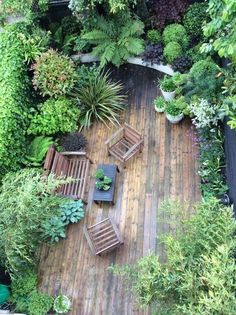 an aerial view of a wooden deck surrounded by greenery and potted plants with the words interrest on it