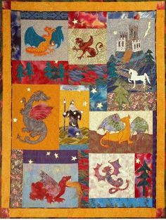 a quilted wall hanging with dragon images on it