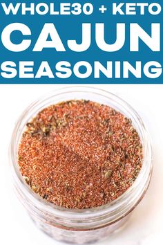 a jar filled with cajun seasoning on top of a white table