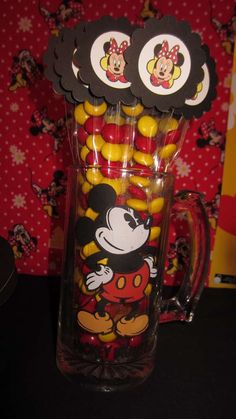 mickey mouse candy in a glass mug