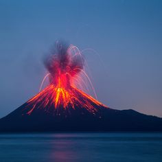 the volcano is lit up with red and orange lights