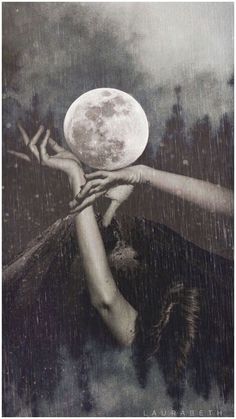 a woman holding the moon above her head while it is raining in black and white