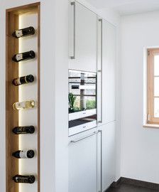 a wine rack in the corner of a kitchen