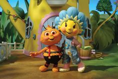 an animated character standing next to another character in front of a yellow and blue building