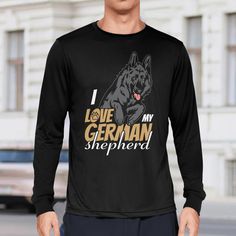 a man standing in front of a building wearing a black german shepherd t - shirt