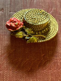 "RARE BSK Signed My Fair Lady Eliza Doolittle Basket Weave Flower Hat figural brooch. Quite the collector's item. This line was designed in 1962 and was sold in the movie theatres where \"My Fair Lady\" was featured. Signed \"BSK inside the hat and \"My Fair Lady\" on a cartouche on the inside of the brim. Beautiful and rare basket weave gold tone Eliza Doolittle hat framed with clear chatons with a focal point of a red enamel rose tipped in gold, green enamel leaves tipped in gold. Missing some Eliza Doolittle, Williamsburg Va, Flower Hat, Found Object Art, My Fair Lady, Fair Lady, Wedding Brooch, Flower Hats, Green Enamel