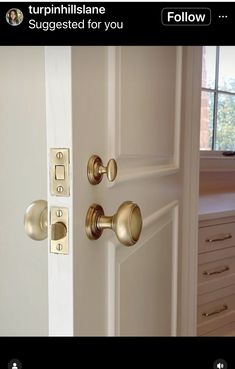 an open door with two knobs on each side and the other side is shown