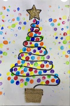 a christmas tree made out of paper and colored circles on a white background with gold stars