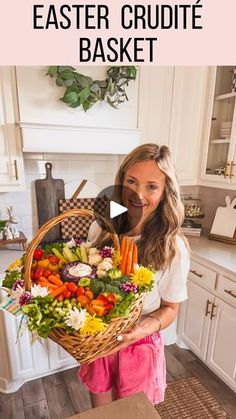 a woman holding a basket full of vegetables in the kitchen with text overlay that reads how to make an easy easter crudie basket