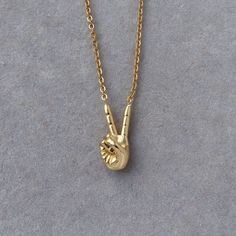 "'Peace' Hand Sign Necklace   Cool & funky wearable statement jewelry ○Chain lengths available: (18\") (20\") (22\") (24\") ○Width: 1.2mm ○High Quality 18k Gold plated brass & stainless steel ○Water resistant & tarnish resistant  Can be worn on it's own or layered with other pieces !" Gold Peace Sign Jewelry Gift, Gold Jewelry With Peace Sign For Gift, Adjustable Peace Sign Necklace As Gift, Adjustable Peace Sign Necklace, Symbolic Peace Sign Jewelry For Gift, Spiritual Peace Sign Necklace As A Gift, February Birthstone Jewelry, Peace Sign Necklace, Feminine Necklace