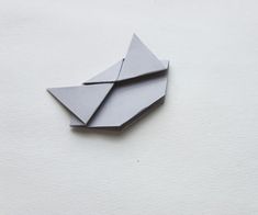 two origami airplanes sitting on top of each other