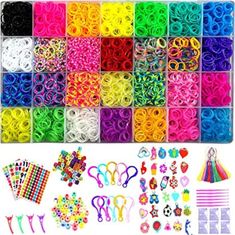 lots of different colors and sizes of hair clips in a box with scissors, beads, pins