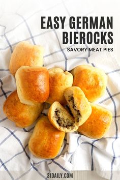 some bread rolls are on a towel with the words easy german bierocks savory meat pies