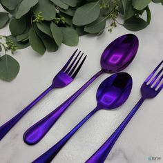 five purple spoons and two forks on a table