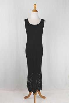 "Vintage Krochetta by Papillon Long Sleeveless Black Crocheted Dress  1920's inspired black crocheted gown Sleeveless with a scoop neck and back 100% Rayon, fully lined with  stretchy jersey Size Petite Large Measurements taken unstretched Bust 36\" Waist 34\" Hips 38\" Length 54\"  Shoulder to hem 63\" Shoulders 16\" Condition: Excellent  condition" Fitted Sleeveless Crochet Dress With Lace Trim, Sleeveless Stretch Lace Maxi Dress, Stretch Lace Sleeveless Maxi Dress, Fitted Sleeveless Crochet Evening Dress, Black Crochet Maxi Dress For Summer, Sleeveless Crochet Dress For Spring Evenings, Black Sleeveless Lace Crochet Dress, Black Sleeveless Crochet Evening Dress, Black Fitted Crochet Dress For Summer