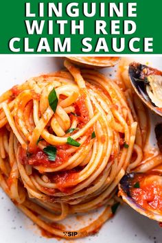 spaghetti with clams and tomato sauce on a white plate, ready to be eaten