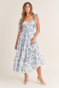 Channel sunny-day vibes in this romantic midi sundress topped by flirty shoulder ties and styled with a sultry ruched bust. • Chiffon floral print • Ruched bust • Light bra-cup • Tiered midi dress• Self tie shoulder straps• Back smocked • Back Zipper detail Cindy Dress, Party Bottoms, Flower Maxi Dress, Floral Bustier, Midi Sundress, Blue Florals, Bra Cup, Chiffon Floral, Tiered Midi Dress