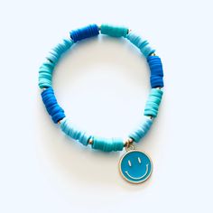 - Smiley Face is approx 1/2" diameter- Smiley Face is made of metal- Colorful beads are made of clay (feel almost like rubber)- Bracelets made on heavy duty elastic for easy on and off Adjustable Blue Stretch Bracelet With Heart Beads, Adjustable Novelty Jewelry With Colorful Beads, Trendy Blue Heishi Beads Bracelets, Trendy Blue Heishi Beaded Bracelets, Trendy Blue Heishi Beads Jewelry, Trendy Blue Jewelry With Large Beads, Playful Adjustable Bracelets With Heart Beads, Playful Adjustable Blue Friendship Bracelets, Playful Adjustable Bracelet With Heart Beads