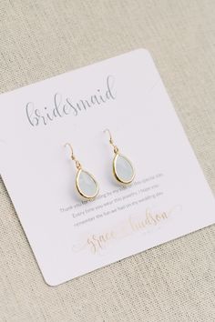 the bridesmaid earrings are made with gold plated metal and clear glass tears