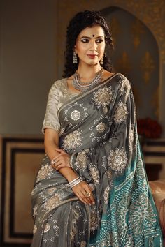 Gorgeous dark grey tussar georgette saree is a perfect choice for weddings and festive occasions!. It has a contrasting green pallu and comes with a beautiful embroidered blouse. Disclaimer: The actual product may vary slightly from the image. These are custom orders, hence expect slight variation in color, placement of the motif or buta. ESTIMATED DELIVERYBecause this is a custom order, it would take about 4 weeks from the date of purchase. RETURN POLICYThis product is a custom order and cannot be returned or exchanged. Grey Saree Contrast Blouse, Gray Traditional Wear For Festive Occasions, Gray Festive Traditional Wear, Festive Gray Traditional Wear, Gray Saree With Zari Work For Wedding, Gray Traditional Wear With Zari Work For Diwali, Gray Saree With Dupatta For Wedding, Traditional Gray Lehenga For Festive Occasions, Traditional Gray Festive Lehenga