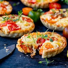 several mini quiche pies with tomatoes and herbs