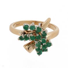 "This is a gorgeous green Estate Emerald Cluster Bypass Estate Ring, set in high polished 14K Yellow Gold. The Bypass Ring is adorned with 15 Round Emerald Gemstones, measuring 2 mm each, weighing 0.60 CTW, set in a Cluster Setting, over the top of the Ring. The Ring is a Size 6.25 (Resizable)*. This stunning piece of Fine Vintage Gemstone Jewelry is being offered here for an unbeatable WHOLESALE price! A beautiful Bypass Design with gorgeous green Emeralds! A truly Classic piece! Metal: 14K Yel Green Birthstone Ring Fine Jewelry, Green Cluster Diamond Ring Fine Jewelry, Green Diamond 14k Gold Ring For Anniversary, Green 14k Gold Diamond Anniversary Ring, Green 14k Gold Diamond Ring For Anniversary, 14k Gold Green Diamond Ring With Prong Setting, Green Diamond Ring With 14k Gold Prong Setting, Green Diamond Ring In 14k Gold For Anniversary, Green Cluster Multi-stone Rings