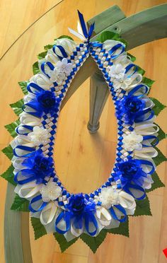 a blue and white wreath on top of a wooden table