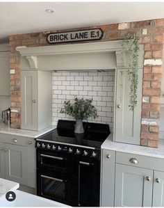 a black stove top oven sitting inside of a kitchen