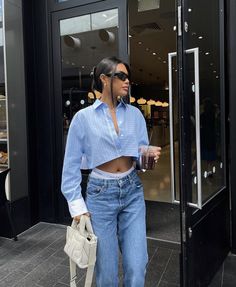 Airport Outfit Street Style, Trendy Denim Blue Top For Streetwear, Blue Denim Tops For Streetwear, Washed Blue Denim Tops For Streetwear, Light Blue Winter Streetwear Top, Blue Summer Streetwear Sets, Classy Skirt Outfits, Emrata Style, Athleisure Outfits Summer