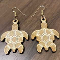 "Laser-crafted, hand-finished sea turtle earrings.  Made from extremely light weight poplar wood, with gold-filled ear wires and jump ring for the best possible durability with a finish that is hypoallergenic and tarnish-free.  Gold-filled is a base metal that is wrapped in a very thick coating of 14K gold, more than 100 times thicker than gold plating and will last a lifetime.  We only use gold-filled components in our jewelry - yes it costs more, but it's worth it.  Since these are crafted fro Personalized Jewelry Box, Custom Dog Tags, Turtle Earrings, Earring Post, Hanging Earrings, Swarovski Earrings, Poplar Wood, Wood Earrings, Copper Earrings