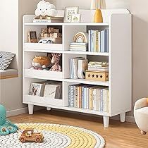 a white bookcase with lots of books on it in a child's room