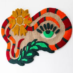 a colorful rug with an eye on it