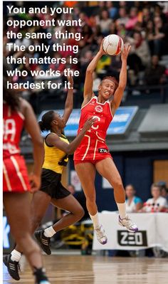 a woman jumping up in the air to catch a ball