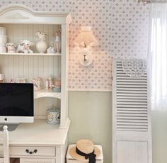 a white desk with a computer on top of it