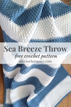 a blue and white striped blanket sitting on top of a wooden floor with text overlay that reads sea breeze throw free crochet pattern