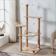 a cat tree in the corner of a room