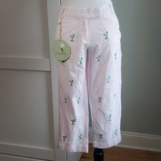 Castaway Cropped, Pink And White Sear Sucker Pants With Embroidered Cocktail Glasses. Sizes 2 & 4 Fun, Lightweight Cropped Pants, New With Tags. Embroidered With Margarita Glasses. Double Closure Features A Button And A Metal Tab. White Capris With Pockets For Vacation, Spring Vacation Cotton Capris, Cotton Capris For Vacation In Spring, White Casual Capris For Vacation, Preppy Cotton Bottoms For Vacation, Preppy Cotton Vacation Bottoms, Preppy Bottoms For Spring Vacation, Preppy Bottoms For Beach And Spring Season, Preppy Bottoms For Beach In Spring