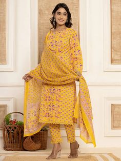 This 3-piece set includes yellow cotton ethnic motif print straight shape pakistani style kurta has round neck, full sleeves, straight hem, calf length teamed with printed trouser pants has elasticated waistband & slip on closure and a printed voile dupatta. Washing instructions state to hand wash. The model wearing the size small is 5'8 in height. 3 Piece Set Color-Yellow Suit Fabric- Cotton Dupatta Fabric-Voile Work - Ethnic Motif Print detailing Neck - Round Neck Sleeves - Full Sleeves Length Yellow Anarkali Set With Straight Kurta And Printed Motifs, Yellow Anarkali Set With Printed Motifs, Anarkali Sets With Printed Motifs In Yellow, Semi-stitched Block Print Long Sleeve Sets, Yellow Mulmul Palazzo Set With Printed Motifs, Yellow Printed Mulmul Palazzo Set, Yellow Salwar Kameez With Printed Motifs For Navratri, Yellow Printed Palazzo Set For Diwali, Yellow Navratri Salwar Kameez With Printed Motifs