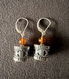 Exquisite Bali beads paired with amber, dangling elegantly from lever back earrings measuring 1/2 inch in length. Bali Silver, Henderson Nv, Quartz Beads, Stunning Earrings, Faceted Crystal, Crystal Quartz, Silver Beads, Beaded Earrings, Quartz Crystal