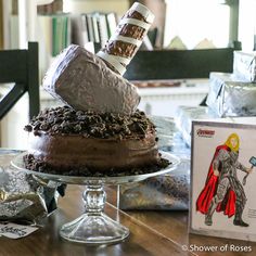 there is a cake on the table that has been decorated with an image of thor