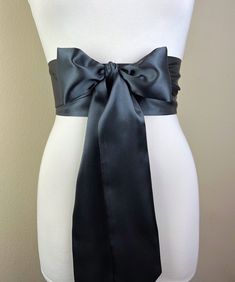 "Charcoal Gray Sash  Dark Gray Satin Sash  Extra Long Sash  Formal Dress Sash  Satin Sash Belt  Bridesmaid Wedding Dress Sash  Satin Swank  Make this Satin Swank® reversible waist sash the perfect finishing touch for your wedding, bridesmaid, or special occasion dress, or just the right piece to add instant polish to your dress or top.  This extra long version is 3.5 inches wide, 120 inches long, and will wrap around most waist sizes two times with a generous length remaining to tie in a bow or Fitted Sashes With Satin Bow, Fitted Bridesmaid Sash, Wedding Sash With Tie Back, Fitted Evening Sash With Tie Back, Fitted Tie Back Sash For Evening, Formal Satin Bridal Belt With Sashes, Satin Sashes For Bridesmaids, Fitted Satin Bow Sash For Bridesmaids, Wedding Sashes With Satin Finish