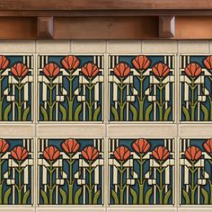 an art deco tile design with red flowers on blue and green tiles in the background