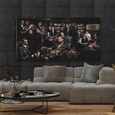 a living room filled with furniture and a large painting on the wall