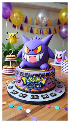 a pokemon birthday cake with balloons and streamers