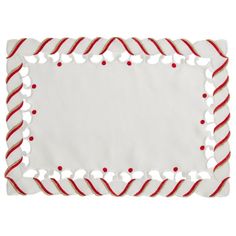 a white plate with red and white candy canes on it