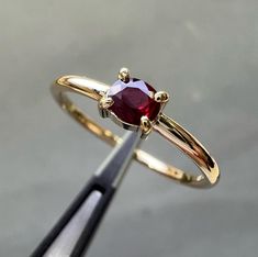 Ruby Ring-Oval Ruby Ring-Sterling Silver Ruby Ring-Stackable Ring-dainty Ring-Solitaire Ring-14k Solid Gold Ruby Ring-July Birthstone Ring ABOUT RING   Gemstone - Ruby ( LAB ) Gemstone size - 7x5mm Stone Cut - Oval Faceted Setting Type - Prong ------------------------------------------------------------------------------------------------------------------------------------------------- Fast Shipping: It will take 1-8 business days to send out your item About us- We are the manufacturers and sup Round Ruby Birthstone Ring Stamped 14k, Ruby Promise Ring With Bezel Setting, Heirloom Ruby Solitaire Ring, Gold Stacking Rings, Silver Ruby Ring, July Birthstone Ring, Red Garnet Ring, Ruby Ring Gold, Red Stone Ring