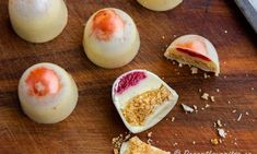 some desserts are sitting on a cutting board and ready to be cut into pieces