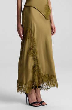 Tonal lace trim highlights the asymmetric silhouette of this smooth satin skirt. 35" length 100% viscose with 100% nylon contrast Dry clean Imported Satin Lace Skirt, Tailor Clothes, Satin Maxi Skirt, Tailored Clothes, Lace Midi Skirt, Lace Outfit, Satin Midi Skirt, Winter Skirt, Silk Lace